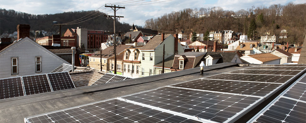 View from the roof of the Millvale Community Library, where they have installed enough solar panels to provide more energy than they can use. Houses and building of the boro are visible in the background.